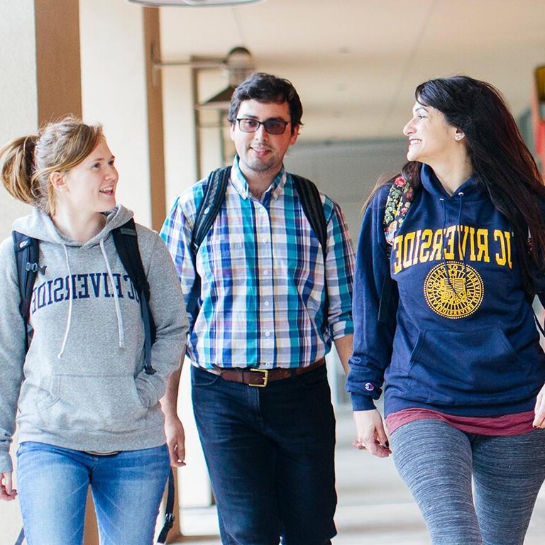 Students walking and smiling